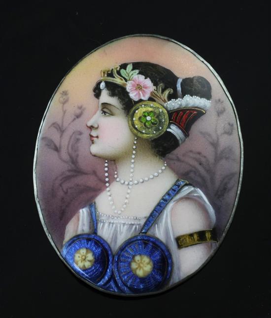 A polychrome enamelled miniature portrait of a lady to dexter, 3.25in.